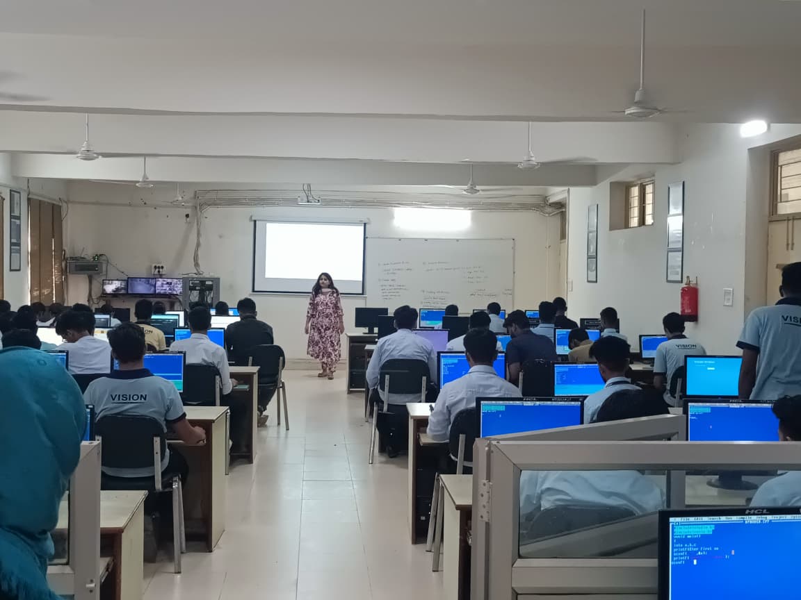 Students coding at workstations in a Vision Kanpur computer lab